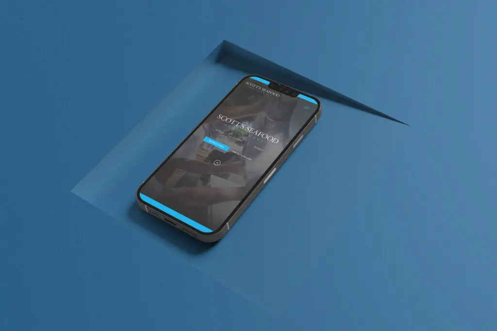 Scotts Seafood Roundhouse responsive website shown on mobile phone