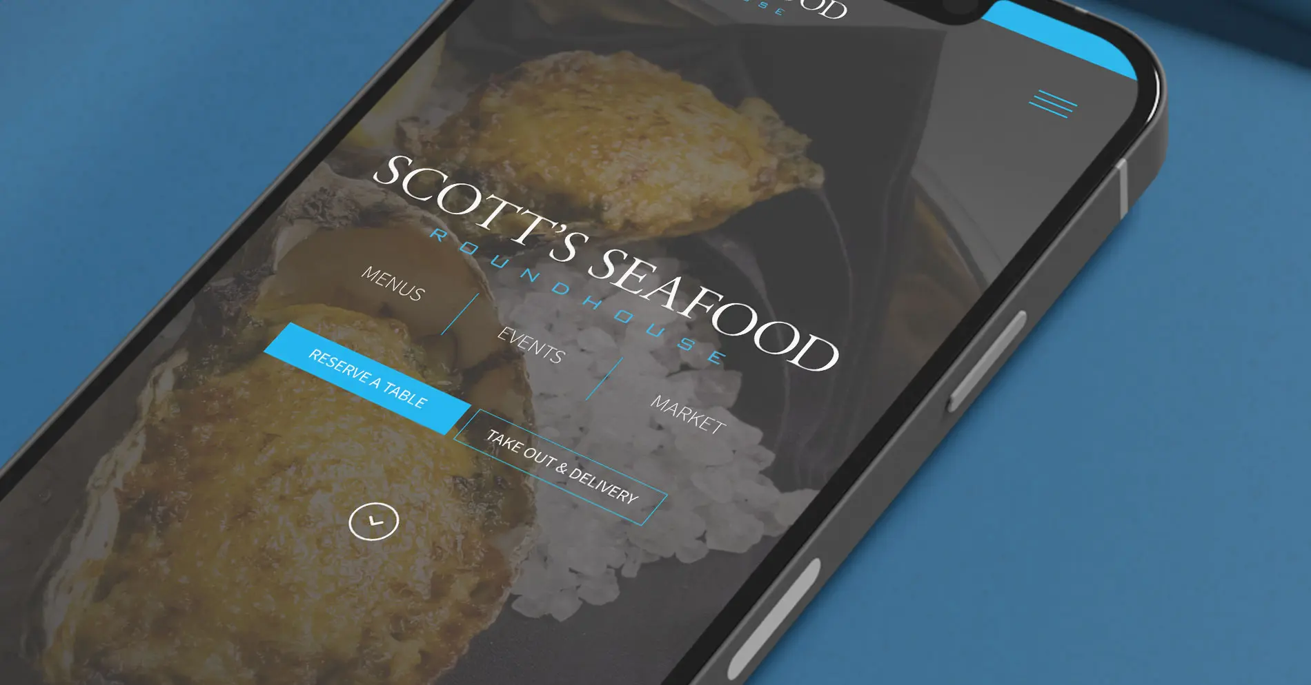 Scotts Seafood Roundhouse responsive website shown on mobile phone