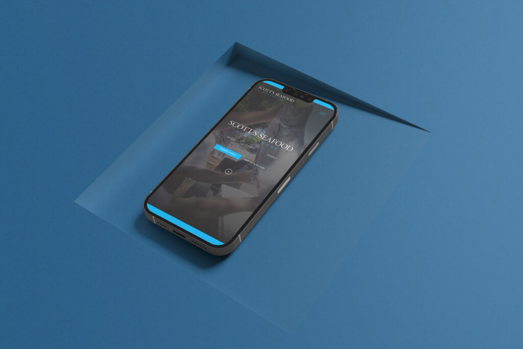 Scotts Seafood Roundhouse responsive website shown on mobile phone